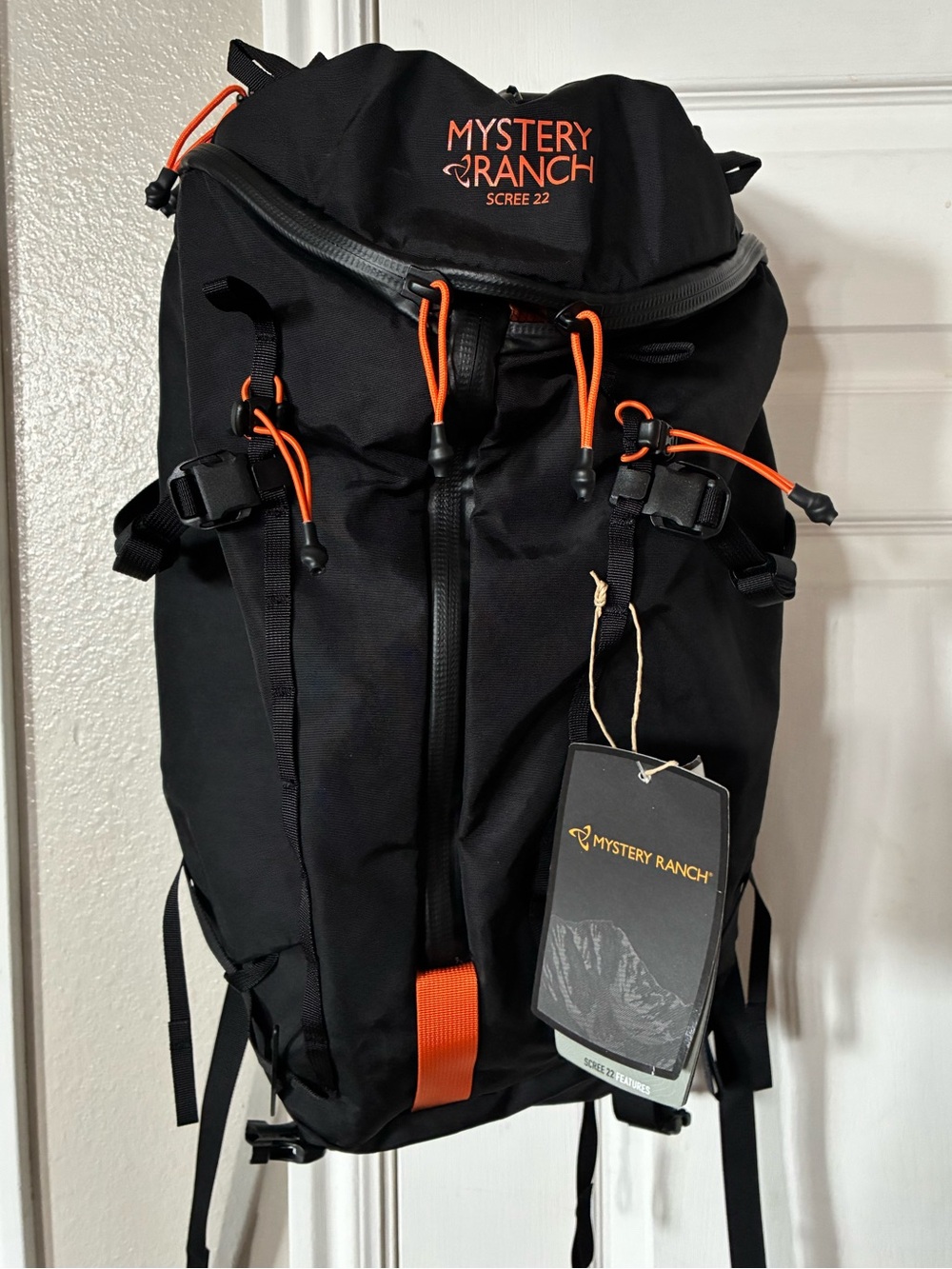 MYSTERY RANCH Scree 22 Backpack in Black with Orange Accents